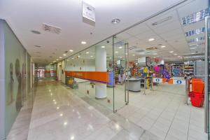 a shopping mall with a glass door in the middle at Dubrovnik Luxury Apartment Lapad in Dubrovnik
