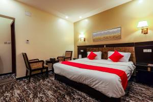 מיטה או מיטות בחדר ב-Beautat Hotel