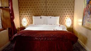 Ein Bett oder Betten in einem Zimmer der Unterkunft Riad Wow