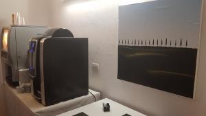 Telewizja i/lub zestaw kina domowego w obiekcie Villa Tuscany Siena