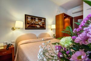 Postel nebo postele na pokoji v ubytování Hotel San Lino