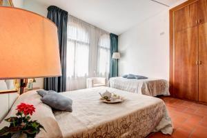 Postel nebo postele na pokoji v ubytování Hotel San Lino