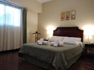 Voodi või voodid majutusasutuse Hotel Hernandarias toas