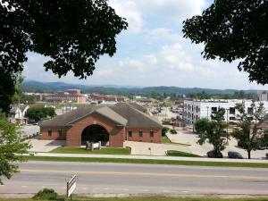 a large brick building on the side of a street at Wingate by Wyndham Elkins in Elkins