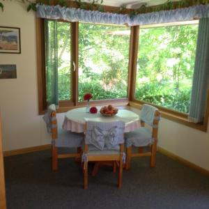 a dining room with a table and chairs and a window at Adelaide Hills B&B Accommodation in Stirling