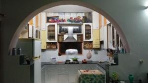 a kitchen with an archway in the middle of it at Aadhaar in Lucknow