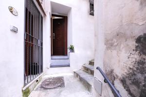 an entrance to a building with a door and stairs at Alfieri Rooms - Luna - Amalfi Coast in Atrani