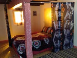 Voodi või voodid majutusasutuse Auberge Aain Nakhla toas