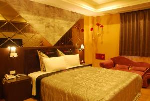 Tempat tidur dalam kamar di QK Motel