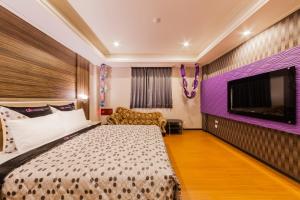 Tempat tidur dalam kamar di QK Motel