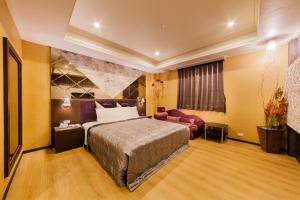 Tempat tidur dalam kamar di QK Motel