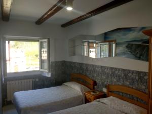 En eller flere senge i et værelse på Agerre Goikoa Agroturismo