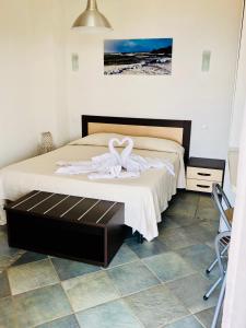 Posteľ alebo postele v izbe v ubytovaní Casale Regina