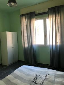 a bedroom with a large bed and a window at The Horse in Pogno +6 photos