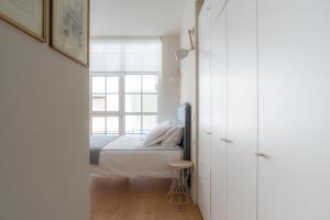 A bed or beds in a room at Mini loft Moscova