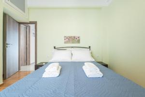Кровать или кровати в номере Acropolis 4U!