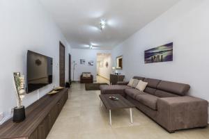 TV o dispositivi per l'intrattenimento presso Sunny Modern Apartments