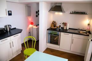 a kitchen with a sink and a stove top oven at Ferienwohnung Christine in Thale