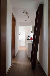 a hallway leading to a kitchen with a hallway leading to a room at Ferienwohnung Christine in Thale +10 photos