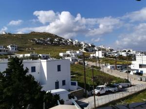 a view of a city with white buildings at Serifos Palace in Livadakia