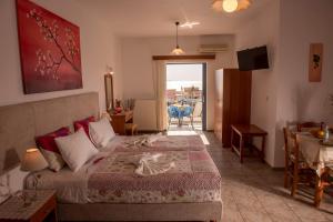 A bed or beds in a room at Roula Apartments