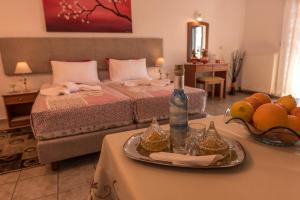 A bed or beds in a room at Roula Apartments