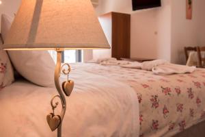 A bed or beds in a room at Roula Apartments