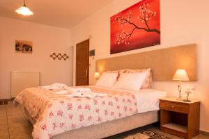A bed or beds in a room at Roula Apartments