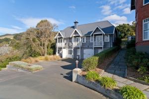 a large house with a driveway in front of it at Braestone Lodge in Dunedin