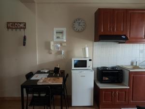 Köök või kööginurk majutusasutuses Cozy Loft