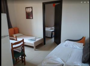 Un ou plusieurs lits dans un hébergement de l'établissement Ksamil Apartments