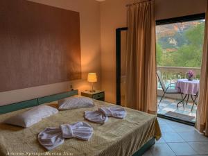 A bed or beds in a room at Acheron Springs-Markou Ilias
