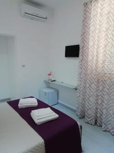 Posteľ alebo postele v izbe v ubytovaní Flamingo Rooms