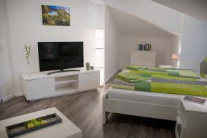 מיטה או מיטות בחדר ב-Apartmenthaus Luise