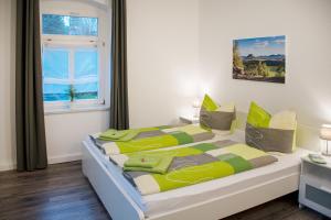 מיטה או מיטות בחדר ב-Apartmenthaus Luise