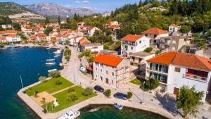 an aerial view of a town next to the water at House Ljilja in Rogotin +22 photos