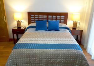 Postel nebo postele na pokoji v ubytování Cangas Popa