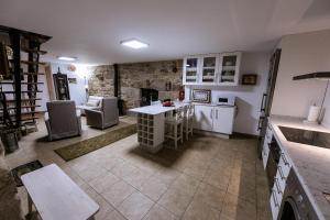 a kitchen with a counter and a table in it at Casa Gloria in Camariñas