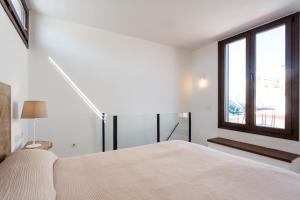 Postel nebo postele na pokoji v ubytování Almazen apartamentos, Arrayan 23
