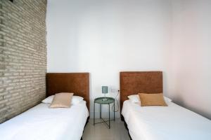 Postel nebo postele na pokoji v ubytování Almazen apartamentos, Arrayan 23