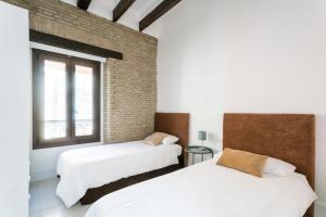 Postel nebo postele na pokoji v ubytování Almazen apartamentos, Arrayan 23