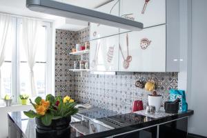 a kitchen with a counter with flowers on it at Apartment Travel hub *** in Varaždin