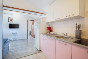a kitchen with a sink and a counter top at APARTMENT MAJER 2 in Medulin