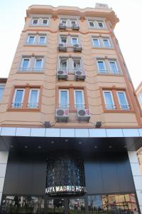 a large building with windows on top of it at Kaya Madrid Hotel in Istanbul