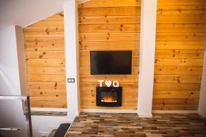 TV a/nebo společenská místnost v ubytování Suite del Amore