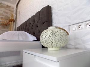 Posteľ alebo postele v izbe v ubytovaní Petite Palace Aristotelous 8