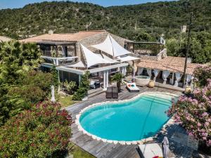 an aerial view of a house with a swimming pool at Villa Petra Bianca Suites & Chambres in Bonifacio