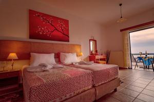 A bed or beds in a room at Roula Apartments