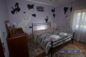 Cama ou camas em um quarto em Etna Travellers B&B