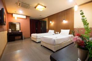 Lova arba lovos apgyvendinimo įstaigoje Khon Kaen Ruenrom Hotel